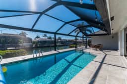 Charming 4 Bed Waterfront Escape w/ Heated Pool and Dock - Image 3