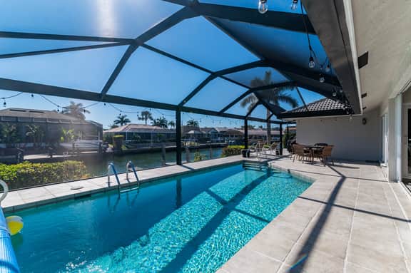 Charming 4 Bed Waterfront Escape w/ Heated Pool and Dock - Image 3